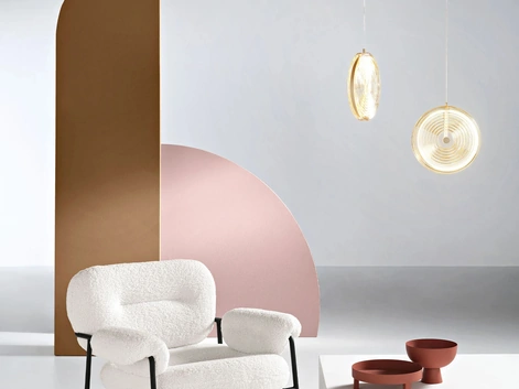 Poltrona Kent in tessuto bouclè di Ikone Casa